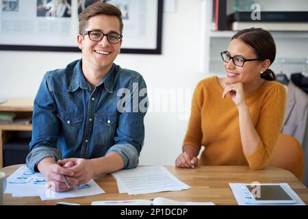 Having fun as creative collaborators. Portrait of two colleagues working together on a creative project. Stock Photo