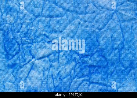 blue color painted on creased canvas background texture Stock Photo