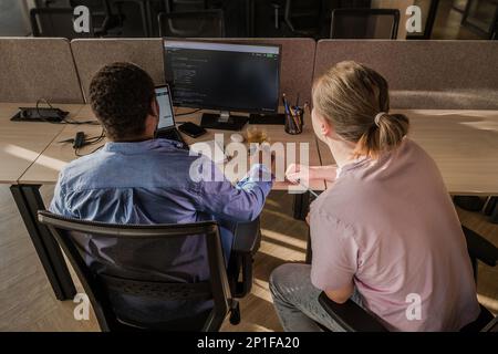 Team of professional software developer and brainstorming and programming on site, software and technology work. Coding technologies, site design Stock Photo