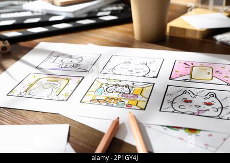 Pre Processing Cartoon Storyboard with cartoon sketches at workplace. Pre-production process ...