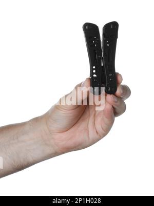 Man holding multitool on white background, closeup Stock Photo