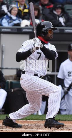 Chicago White Sox's Jimmy Rollins, front, throws his bat after