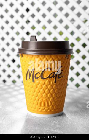 MYKOLAIV, UKRAINE - AUGUST 12, 2021: Hot McDonald's drink on grey table Stock Photo