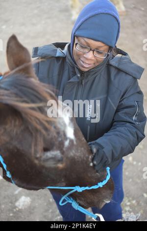 The 13th ESC's chaplains hosted a retreat to connect soldiers with the outdoors and animal therapeutics at the Belton Lake Outdoor Recreation Area (BLORA) Horse Riding stable, today.   U.S. Army Ch. Jeffrey 'Father' Whorton, the unit command chaplain, said the intent was to put soldiers in a different environment and take their minds off their troubles to give them a new perspective. 'When you break that routine you have a chance to reset,' he said. He continued that it allows them to care for their souls and be conduits of grace and mercy to others in our unit.  'Beauty can arrest us,' said W Stock Photo