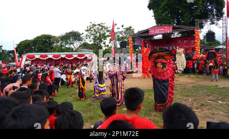 Reog Traditional Art And Crowds Of People Watching, In The City Of Muntok During The Day In Muntok Stock Photo