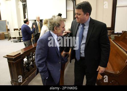 Defense attorney William Kutmus talks with his client's parents ...