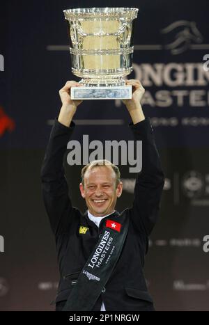 Macro Kutscher of Germany holds up his trophy after winning the