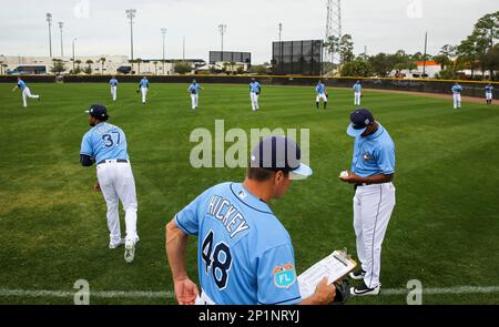 Tampa Bay Rays pitching coach Kyle Snyder, left, looks on as Shane  McClanahan holds his all-star jersey before a baseball game against the  Baltimore Orioles Saturday, July 16, 2022, in St. Petersburg