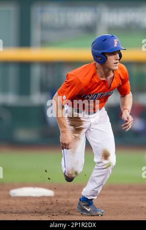 Florida Gators outfielder Harrison Bader (8) slides head first into second  base against the Miami Hurricanes in the NCAA College World Series on June  17, 2015 at TD Ameritrade Park in Omaha