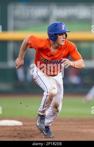 Florida Gators outfielder Harrison Bader (8) slides head first into second  base against the Miami Hurricanes in the NCAA College World Series on June  17, 2015 at TD Ameritrade Park in Omaha