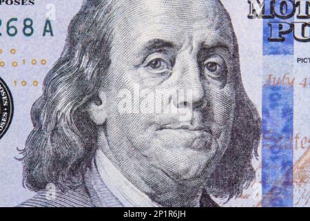 Benjamin Franklin portrait macro usa dollar banknote or bill. Benjamin Franklin's look on a one hundred dollar bill Stock Photo