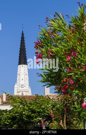 France. Charente-Maritime (17) Ile de Re, village of Ars-en-Re, the bell tower of the Saint Etienne church painted in black and white to serve as a la Stock Photo