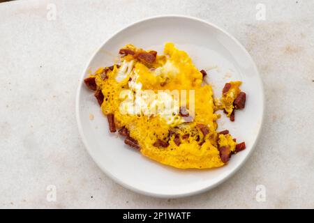 A plate of eggs with sausage. Breakfast time. Stock Photo