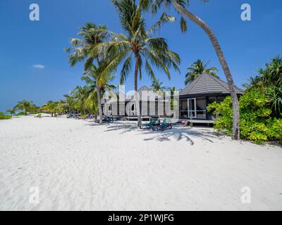 Holiday island in the Maldives, With swimming pool, Huts, and sun loungers, Maldives, Indian Ocean, Asia Stock Photo