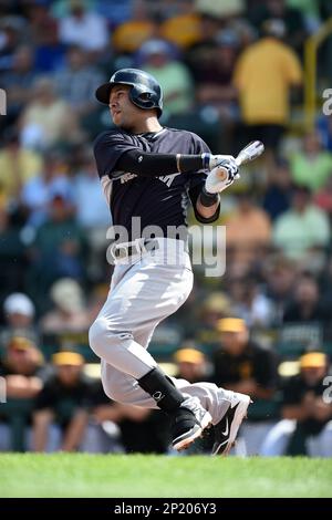 New York Yankees shortstop Cito Culver #90 throws to first after fielding a  grounder during a Spring Training game against the Philadelphia Phillies at  Bright House Field on February 26, 2013 in