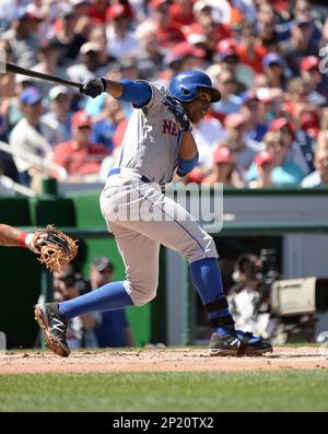 New York Mets' Curtis Granderson wears high socks as he leads off
