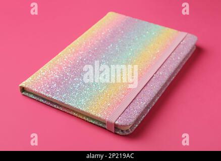 New stylish planner with hard cover on pink background, closeup Stock Photo