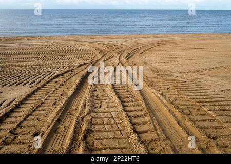 Tyre tracks from shoreline restoration work on the shore of The Wash at Snettisham beach, Norfolk. Stock Photo