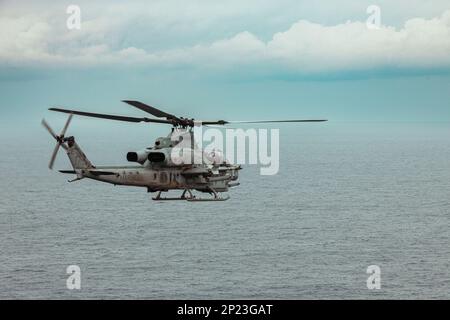 U.S. Marines with Marine Medium Tiltrotor Squadron 262 (Rein.), 31st Marine Expeditionary Unit, pilot an AH-1Z Viper during an special weapons delivery training in the Philippine Sea, Feb. 2, 2023. The specific weapons delivery training increased the squadron’s weapons proficiency in close air support. The 31st MEU is operating aboard ships of the America Amphibious Ready Group in the 7th Fleet area of operations to enhance interoperability with allies and partners and serve as a ready response force to defend peace and stability in the Indo-Pacific region. Stock Photo