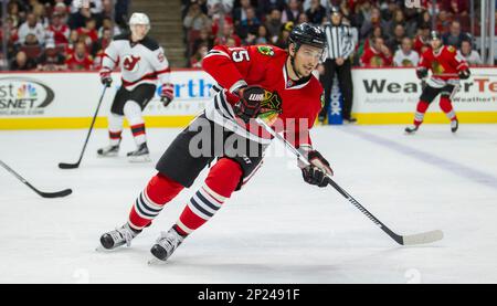 November 12, 2015: Chicago, Illinois, U.S. - Blackhawk #67 Tanner Kero sets  up in front of Devil Goaltender #35 Cory Schneider and #8 David Schlemko  during the National Hockey League game between