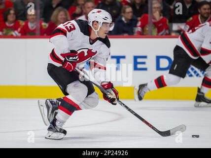 November 12, 2015: Chicago, Illinois, U.S. - Blackhawk #67 Tanner Kero sets  up in front of Devil Goaltender #35 Cory Schneider and #8 David Schlemko  during the National Hockey League game between