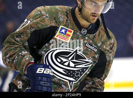 NOV 10, 2015: Columbus Blue Jackets right wing Cam Atkinson (13) wears a  camouflage jersey for Military Appreciation Night during warmups prior to a  NHL game between the Vancouver Canucks and the