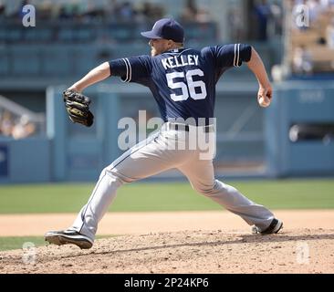 San Diego Padres Shawn Kelley throws the baseball during batting practice  while wearing red, white and blue socks before a ame against the St. Louis  Cardinals at Busch Stadium in St. Louis