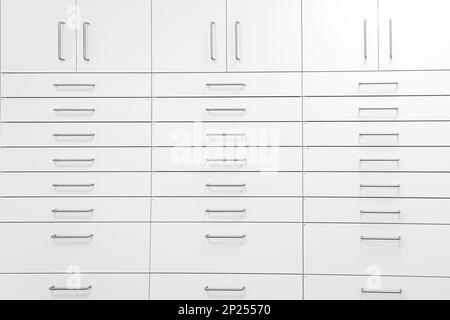 White pharmacy cabinet from side of drawers Stock Photo