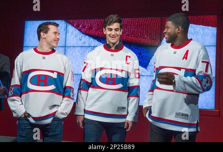 Montreal Canadiens Brendan Gallagher Max Pacioretty and P.K. Subban left to right show off the team s jersey to be worn during the 2016 NHL Winter Classic hockey game Friday Nov. 6 2015 in Montreal. T...