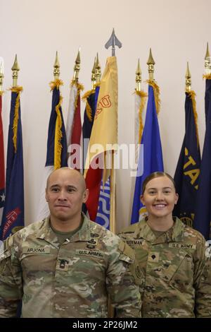 At Camp Buehring, Area Support Group - Kuwait holds a Change of Responsibility Ceremony for the transition of the base support battalion's senior non-commissioned officer. Incoming Command Sgt. Maj. Ruben F. Borja replaces outgoing Command Sgt. Maj. Scott J. Lund as BSB NCOIC, January 13, 2023. Stock Photo