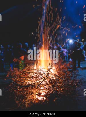 Orthodox Christmas celebration in Montenegro and Serbia, process of burning the Badnjak, fire with oak tree logs and branch during Badnji dan, the Chr Stock Photo