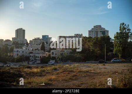 Ramallah Cityscape at Dusk with High Buildings and Trees Stock Photo