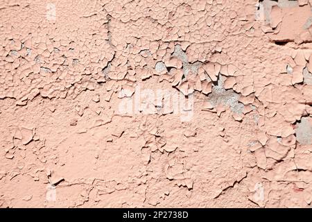 Salmon color abstract cracked paint wall textured background Stock Photo