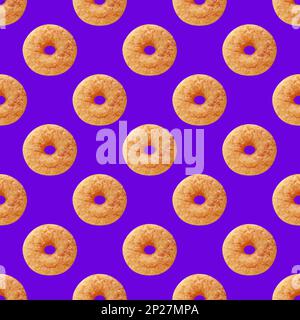 Seamless Pattern of Delectable Cinnamon Doughnut on Cornflower Blue Colored Background Stock Photo