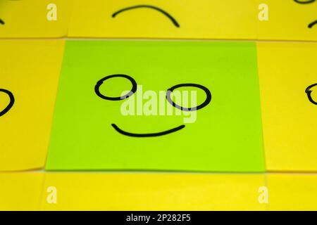 conceptual image for a be different or be happy concept using sticky notes Stock Photo
