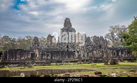 A view of the side of the ruins of the famed Bayon Temple within Angkor Thom near Angkor Wat in Cambodia. Stock Photo