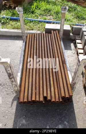 Iron bar for a foundation was anchored to the ground with concrete Stock Photo