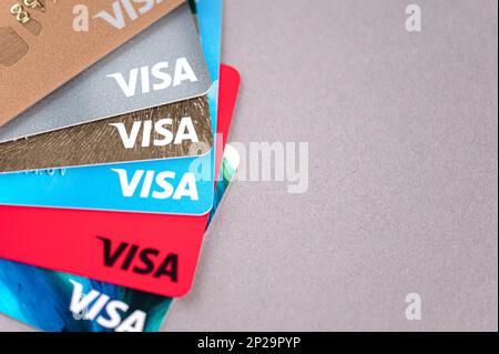 MOSCOW - MAR 03: Set of plastic cards with Visa logotype on a desk with space for text in Moscow on March 03. 2023 in Russia Stock Photo