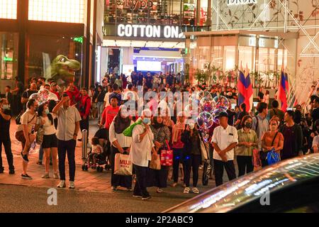 KUALA LUMPUR. 4 March 2023. People wait for crossing the street in Bukit Bintang. Motion blurred. Stock Photo