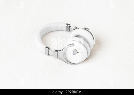 Headphones big noise cancellation white on soft fluffy clean background Stock Photo