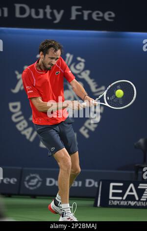 Dubai, UAE, 4th.March, 2023. Russian tennis players at the trophy  presentation, Winner Daniil Medvedev (red shirt) and runner-up Andrey  Rublev at the Dubai Duty Free Tennis Championships tournament at Dubai Duty  Free