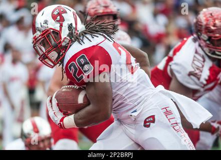 Miami Ohio running back Austin Sykes (29) is brought down by Akron  defensive back Davanzo Tate (5) in the first quarter during their football  game Wednesday, Nov. 14, 2007, in Oxford, Ohio. (