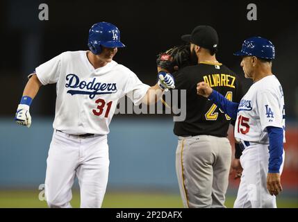 Los Angeles Dodgers first base coach Davey Lopes looks at a