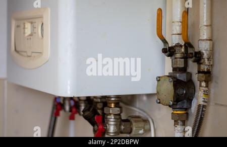 Heating gas boiler. Symbolic image of the heating season at home. The dial on a domestic combi boiler. Hot water and heating. Condensing boiler and Stock Photo