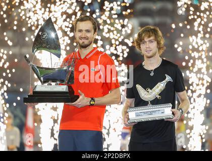 Dubai, UAE, 4th.March, 2023. Russian tennis players at the trophy  presentation, Winner Daniil Medvedev (red shirt) and runner-up Andrey  Rublev at the Dubai Duty Free Tennis Championships tournament at Dubai Duty  Free