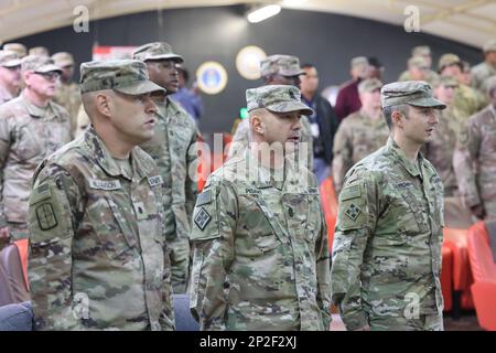 At Camp Buehring, Area Support Group - Kuwait holds a Change of Responsibility Ceremony for the transition of the base support battalion's senior non-commissioned officer. Incoming Command Sgt. Maj. Ruben F. Borja replaces outgoing Command Sgt. Maj. Scott J. Lund as BSB NCOIC, January 13, 2023. Stock Photo