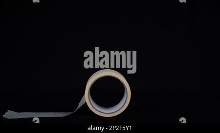 Paper tape. black color Paper tape affixed on the table. paper tape roll Stock Photo