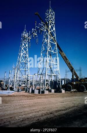 Construction of Electricity Pylons using Crane Saudi Arabia Stock Photo