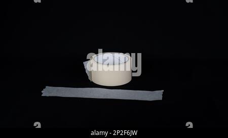 Paper tape. black color Paper tape affixed on the table. paper tape roll Stock Photo