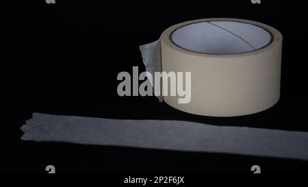 Paper tape. black color Paper tape affixed on the table. paper tape roll Stock Photo